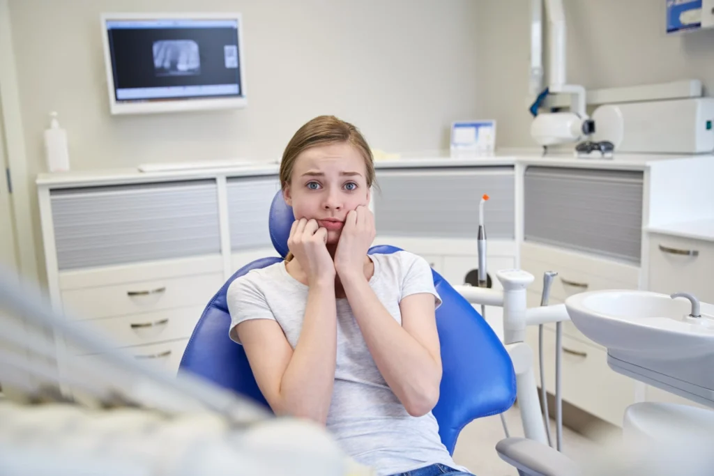 Nervous patient waiting for emergency dental treatment