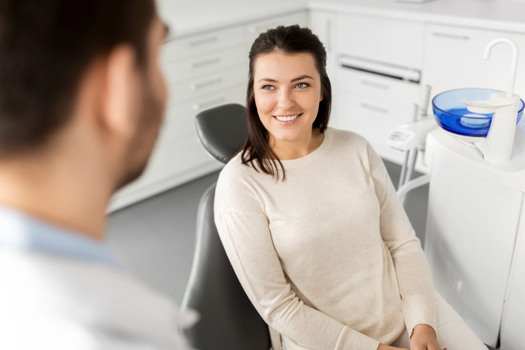 Patient consulting with dentist about teeth whitening