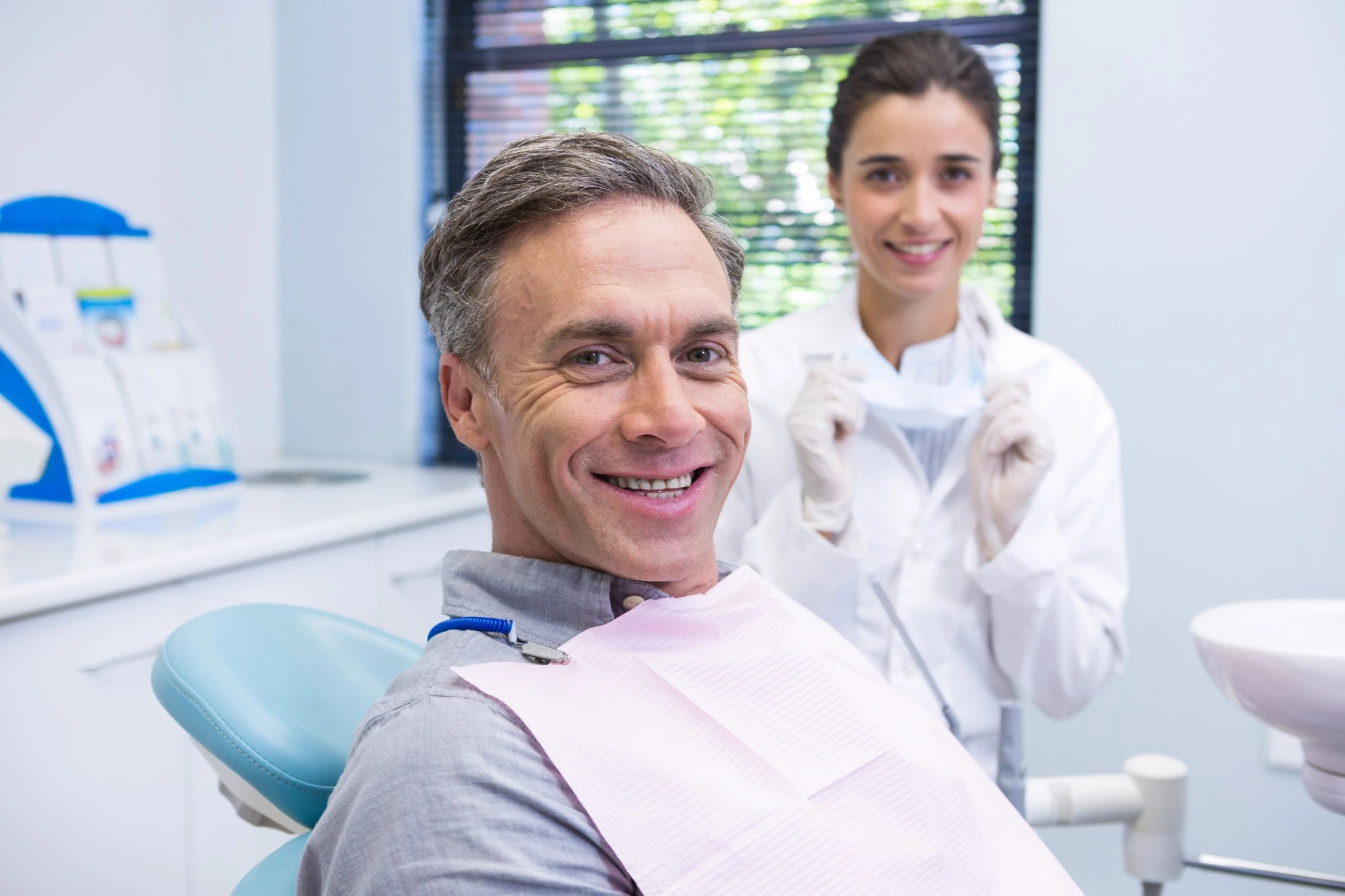 Male patient smiling during dental appointment