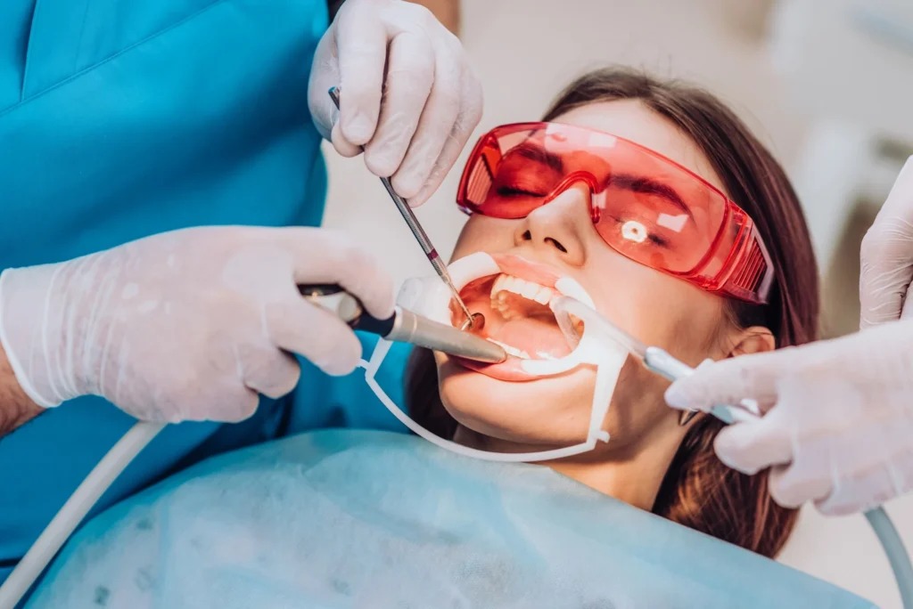 Female patient receiving emergency dental treatment at Fairfield walk-in clinic wearing protective eyewear